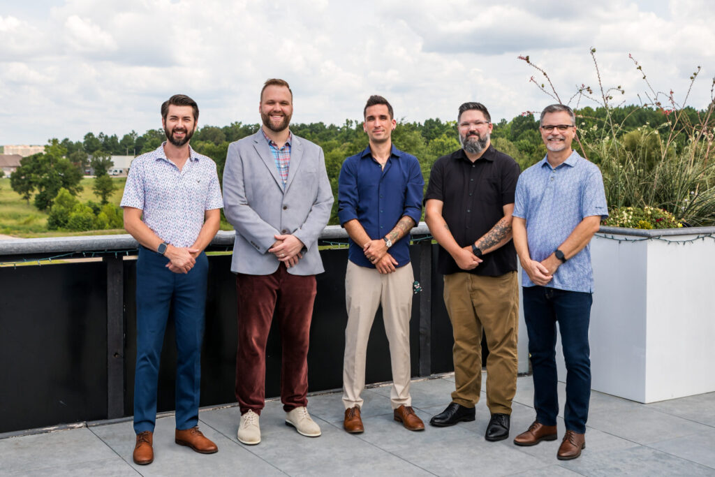 a group photo of the Austin Moore & Company Real Estate