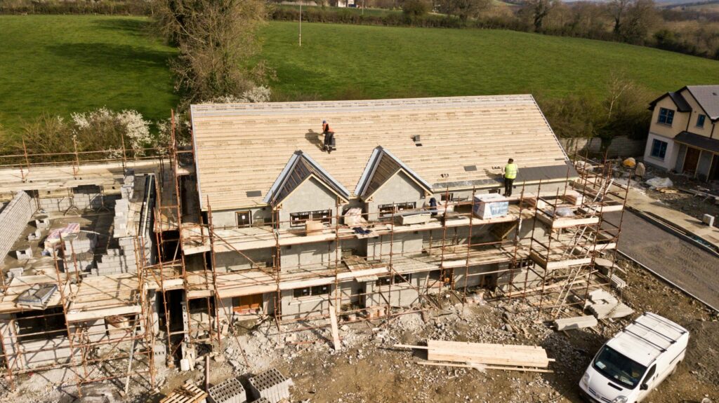 aerial photo of brown 3 story house