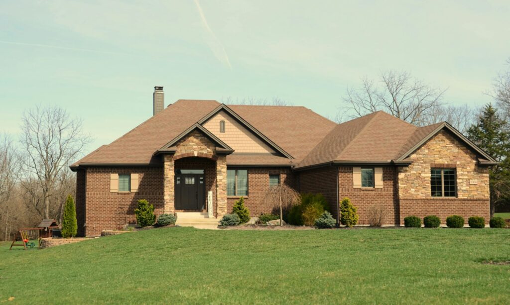 a large brick house with a stone facade
