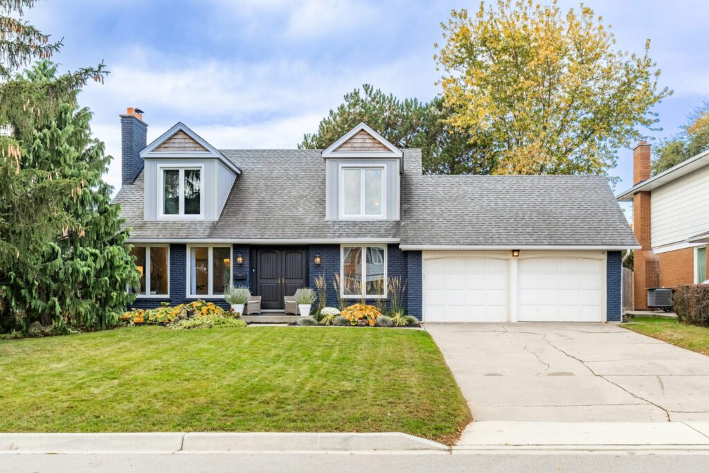 Nice house with two car garage and green lawn